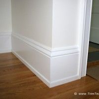 an empty room with hard wood flooring and white paint on the walls is pictured in this image