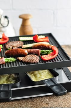 a grill with several different types of food on it