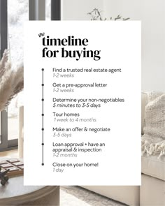 a living room with a white couch and table next to a window that says time for buying