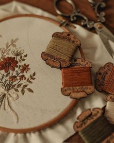 a close up of some embroidery on a table