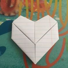 an origami heart shaped piece of paper