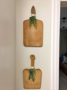 two wooden cutting boards mounted to the wall