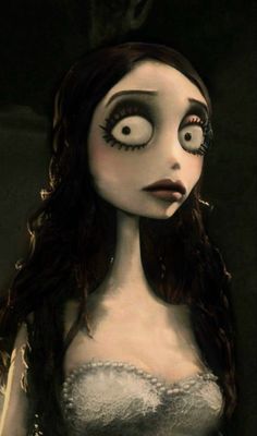 a creepy doll with big eyes and long hair