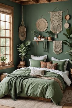 a bedroom with green walls and lots of hanging plants on the wall above the bed