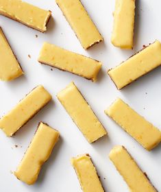 slices of cheese are arranged on a white surface