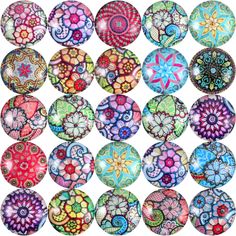 a bunch of different colored glass buttons on a white background with an image of flowers in the middle