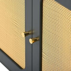 a close up view of the handles on a cabinet with perforated metal panels