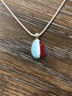 **PLEASE NOTE: THIS LISTING IS FOR THE PENDANT ONLY X-Small Red, White & Blue Fused Glass Pendant. This is a super cute pendant perfect for someone who just likes to wear a small piece of jewelry. Simple yet perfect size! Great piece to dress up any outfit, a wonderful addition to your awesome jewelry collection or perhaps your very first piece of art! Either way I hope it brings you happiness and joy because I truly enjoyed creating it!  This fused glass pendant is created using COE 90 glass in various colors and sizes. The glass is cut and carefully layered into the desired design before firing in the glass kiln. The manipulation of the glass and another firing process ensures that no two pieces are exactly the same guaranteeing a truly one-of-a-kind piece of art for your jewelry collect Patriotic Jewelry, Stained Glass Christmas, Fused Glass Pendant, Jewelry Simple, Military Gifts, Glass Pendant, Red White Blue, Glass Pendants, Fused Glass