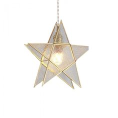 a white and gold star hanging from a chain