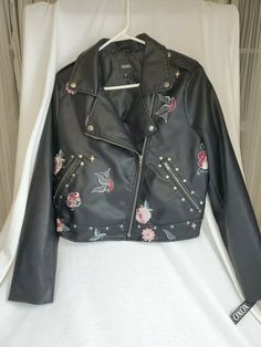 Super Cute Moto Long Sleeve Jacket by XOXO. NWT-Retail $109.00. Black polyurethane material/soft and cool. Embroidered floral, bird, lips, Heart w/xoxo, leaf. Silver studs in designated area's. See photo's provided. Front slanted zippered pockets. Zip up front Great price. Long Sleeve Jacket, Sleeve Jacket, Long Sleeves Jacket, Moto Jacket, Silver Studs, Zip Ups, Bomber Jacket, Super Cute, Lips