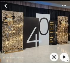 an image of a stage set up for a party with gold decorations and black curtains