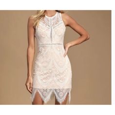 We're Falling Fast And Hard For The Lush Serious Love White Lace Bodycon Dress! Elegant White Lace Overlay And Nude Stretch Knit Shapes A Rounded Neckline, And Sleeveless Bodice With Pierced Crochet Detail Throughout. A Sheer Waist Tops The Figure Flaunting Skirt With A Scalloped Hem. Tying Back Keyhole, Plus Hidden Zipper/Clasp. Lined. Self: 100% Nylon. Lining, Trim #1, & Trim #2: 100% Polyester. Hand Wash Cold. Imported. Style 490622 N White Lace Bodycon Dress For Night Out, White Lace Bodycon Dress For Date Night, Fitted Sleeveless Mini Dress With Scalloped Lace, Sleeveless Scalloped Lace Mini Dress For Night Out, Sleeveless Scalloped Lace Mini Dress For Date Night, White Bodycon Dress With Lace Trim, White Flirty Lace Dress With Scalloped Details, White Lace Trim Bodycon Mini Dress, White Bodycon Mini Dress With Lace Trim