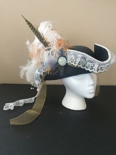 Super luxurious pirate hat. Lots of feathers and a pretty broach.  Woman's sized hat 20 to 21 inches. The color is a pretty steel blue with white and beige feathers.  Have a customization request? Colors, accents, etc? send me a message. Pirate Garb, Medieval Rings, Pirate Outfit, Hat Aesthetic, Viking Costume, Pirate Hat, Pirate Hats, Witchy Fashion, Boater Hat