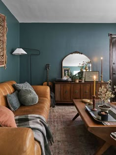 17 Blue-Green Paint Colors You Should Try Brown Leather Sofa Living Room Ideas Bohemian, Cherry Oak Trim Living Room, Luxurious Mid Century Modern Living Room, Oversized Furniture Living Room, Moody Living Room Tv Stand, Mcm Art Deco Living Room, Dark Persian Rug Living Room, Moody Old World Living Room, Bold Interior Design Living Room