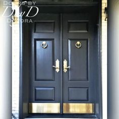 two black doors with gold handles on each side