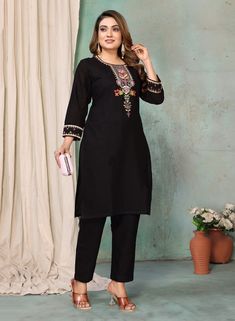 This women's kurta pant set is perfect for those who love a touch of elegance in their outfits. The black color adds a classic and versatile look, while the linen fabric ensures comfort throughout the day. The kurta is adorned with beautiful floral thread embroidery, adding a feminine and stylish touch. With a round neck and 3/4 sleeves decorated with embroidery, it's a perfect blend of traditional and modern design. The pant features a partially elasticated waist for a comfortable fit and a convenient side pocket for added functionality. Festive Elegant Linen Kurta, Elegant Black Pant Set For Festive Occasions, Elegant Cotton Sets For Diwali, Fitted Black Straight Kurta Set, Elegant Cotton Palazzo Set For Diwali, Black Fitted Straight Kurta Set, Elegant Black Long Sleeve Pant Set, Elegant Floral Embroidered Kurta For Workwear, Elegant Floral Embroidered Kurta For Work