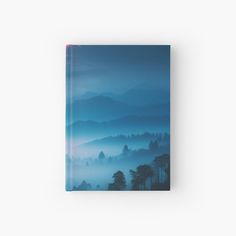 Write your aspirations and daily life using a journal featuring stunning mountain views and a serene mountain aesthetic. Inspired by mountain photography and mountain art, it showcases an illustration of mountains under a blue sky. Perfect for mountain hiking enthusiasts and those who love night sky art with night sky stars and watercolor vibes. This piece adds beautiful mountain scenery to your space.