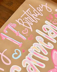 a brown paper bag with pink and blue lettering on it that says happy birthday, 35 years old