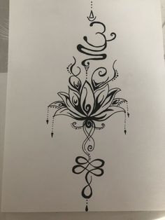 a black and white drawing of a flower with swirls in the middle on a piece of paper