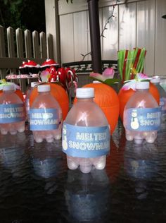 there are many plastic water bottles with labels on them that say melter snowman