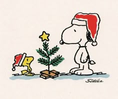 a charlie brown christmas card with the words aida written on it and a cartoon dog next to a small tree