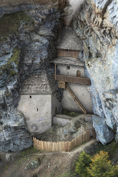 an old house built into the side of a cliff