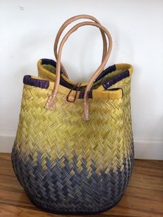 These beautiful pieces are designed in South Africa. Handmade with raffia and featuring leather handles, these bags bring the perfect mix of bohemian chic to everyday wear! Capable of being used as a handbag, basket or storage-this multi-purpose piece is a cannot miss! The double closure top provides a multi-style capability as well! Sizing: 16 inches wide x 12 inches deep x 13 inches high Bohemian Handbags, Bucket Bags, Top Handle Bags, Leather Bucket Bag, Leather Bucket, Product Ideas, Leather Handles, Bohemian Chic, Leather Bags