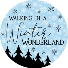 the words walking in a winter wonderland on a blue background with snowflakes and trees