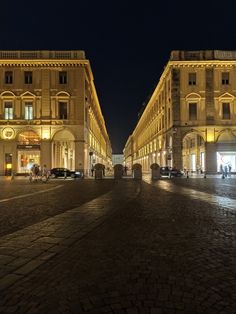 an empty cobblestone street at night in europe