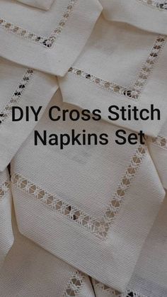 some white napkins with black lace on them and the words diy cross stitch napkins set