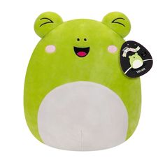 a green and white stuffed animal with a tag on it's ear