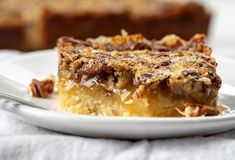 a slice of pecan pie on a white plate