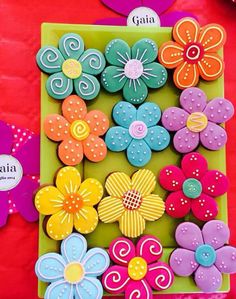 decorated cookies in the shape of flowers on a table