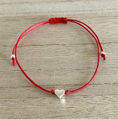 Silver Heart Adjustable Red Cord Bracelet, Gift for Her-Birthday, Anniversary, Christmas, Just because, Red Silver Jewellery, UK Shop Super gorgeous bracelet featuring a cute solid silver plated, nickel and lead free, heart on an adjustable red waxed cotton cord. This adorable bracelet makes a lovely gift for a special loved one. It is sure to put a smile on the recipient's face. The bracelet is 30 cm in length and securely tied with a comfortable sliding knot and is suitable to fit any size wri Adjustable Red Heart Charm Bracelet, Adjustable Heart Shaped Bracelet As Gift, Adjustable Heart Bracelet As Gift, Adjustable Red Friendship Bracelets For Mother's Day, Heart Shaped Bracelet For Gift, Personalized Red Bracelets For Valentine's Day, Adjustable Red Heart Friendship Bracelets, Adjustable Red Heart Bracelet For Valentine's Day, Adjustable Red Bracelet For Birthday