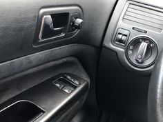 the interior of a car with an automatic gear box and control knobs on it