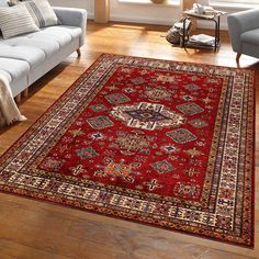 a living room area with couches and rugs