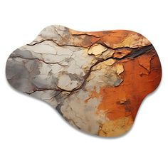 a piece of wood that has been painted orange and white with some brown on it