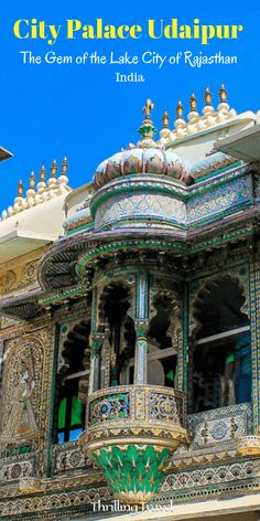 an ornate building with the words city palace uddhpur written in blue and green