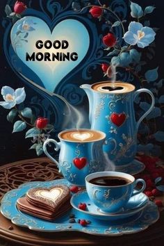 two cups of coffee are sitting on a table with hearts and flowers in the background