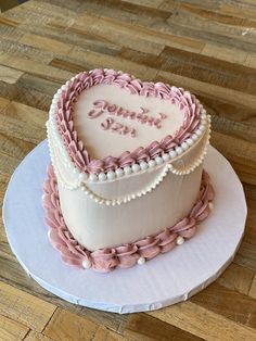 a heart shaped cake on top of a white plate