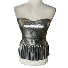 New With The Tag! Adorable Sincerely Jules Metallic Silver Strapless Pleated Crop Top Stretchy Metallic Silver Fabric Sweetheart Neckline Crisscross Striped Pattern Fitted Bodice Waistband Plisse Pleated Peplum Style Hemline Smocked Stretchy Back Cropped There Is A Detachable And Adjustable Strap That Can Be Hooked On For A Halter Look Lined 95% Poly 5% Spandex Size Medium Bust Pit To Pit - 16” Length Without Strap - 15 Tags: Smocked Strapless Metallic Silver Peplum Corset Bustier Fitted Silver Tops For The Club, Metallic Fitted Corset For Party, Fitted Silver Glamorous Tube Top, Glamorous Fitted Silver Tube Top, Metallic Silver Fitted Top For Night Out, Metallic Fitted Tube Top For Night Out, Metallic Strapless Tube Top For Party, Metallic Tube Top For Night Out, Glamorous Silver Strapless Tube Top