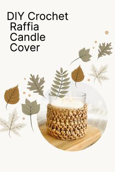 a candle is sitting on top of a wooden table with leaves around it and the words diy crochet raffia candle cover