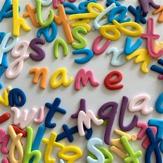 colorful letters and numbers are scattered on a white surface