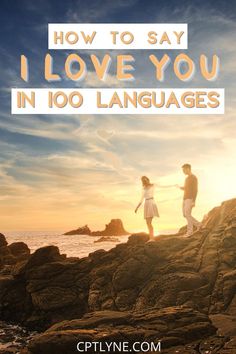 two people standing on rocks with the text how to say i love you in 100 languages