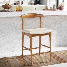 a wooden chair sitting in front of a counter