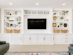 a living room filled with furniture and a flat screen tv mounted on a wall above it