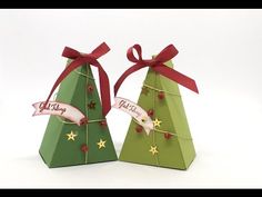 two christmas trees made out of folded paper