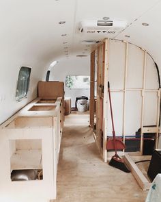 the inside of an rv with wood framing