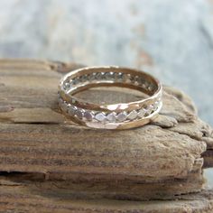 "Fashioned from sterling silver, the 1.5mm-wide \"tiny dots\" stacking band is antiqued to show detail, then tumbled for strength and a high polish. Two lightly hammered and highly polished 14k gold fill stacking bands complete the set. Each of the gold-fill bands is joined using plumb-gold solder (not brass), which has the highest possible gold content and allows for a seamless join. See brightsmith.etsy.com for these rings sold separately, or in a blackened silver finish as shown in the last p Dainty Hand Forged Gold Stackable Rings, Gold Stackable Rings Nickel Free For Anniversary, Nickel-free Gold Stackable Rings For Anniversary, 14k Gold Silver Stackable Rings With Diamond Cut, Gold Sterling Silver Stackable Toe Rings, Silver Stacked Jewelry For Anniversary, Gold Sterling Silver Double Band Stackable Rings, Stacked Silver Jewelry For Anniversary, Gold Double Band Stackable Rings In Sterling Silver