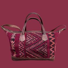 You're going to want to plan a weekend trip just so you can use this beautiful bag! Intertwined's beautifully crafted travel bag is handmade in Morocco from locally tanned leather and vintage, handwoven kilim. Each kilim is one-of-a-kind and handwoven with unique colors and patterns based on the region where it is made. Traditional Brown Travel Bag With Leather Handles, Traditional Brown Rectangular Weekender Bag, Traditional Rectangular Weekender Bag For Travel, Traditional Brown Weekender Bag With Leather Handles, Traditional Travel Bags With Leather Handles, Traditional Tote Weekender Bag For Travel, Traditional Travel Satchel With Leather Handles, Traditional Tote Travel Bag With Leather Handles, Artisan Handwoven Shoulder Bag For Travel